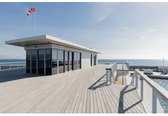 The yacht club's rooftop terrace has enviable views over the marina and the yachts anchored off due to no available berths. You could make one yours
