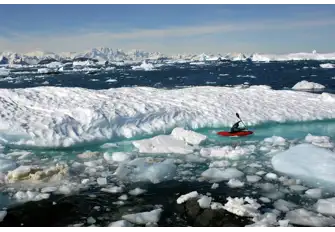 Kayak down the narrow streams between icebergs and glaciers