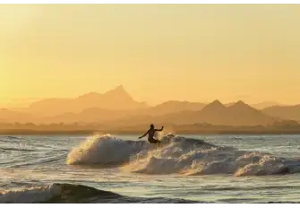 Catch you last waves of the day with a breathtaking sunset view