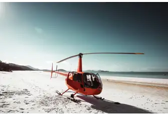 Arrive in style by ending your helicopter tour on one of Whitsunday Islands' sandy beaches 