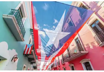 Fabulously colourful and characterful streets in the old town contrast with the weathered stone of San Felipe del Morro Fortress in Old San Juan