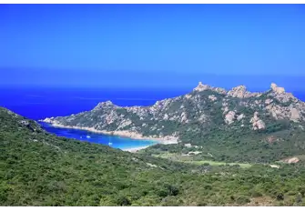 Roccapina Beach overlooked by a Genoese tower and a pink granite lion
