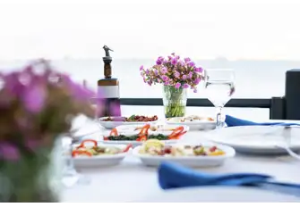 Indulge in fresh seafood at one of Telendos' waterfront restaurants 