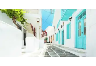 Walk down the cobbled streets of Mykonos and admire the beautiful architecture 