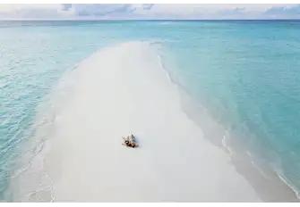 Relax on the soft white sandy beaches of the Maldives
