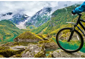 Breath in the fresh crisp air as you cycle up Norway's mountains and take in the stunning landscapes