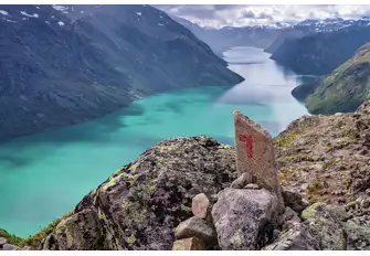 Admire the blue glacier Lake Gjende along the Besseggen Ridge