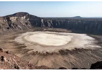 Visit the Al Wahbah Crater in the lava fields of Harrat Kishb