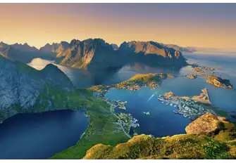 The midnight summer sun casts a golden light over the Lotofen Islands