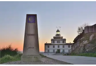 Milestone marker of Finisterre Cape outside the village's lighthouse 