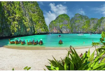 South East Asia is both culturally surprising and quite breathtakingly beautiful, as we see here in the famous Maya Bay in Thailand's Mu Ko Phi Phi National Park