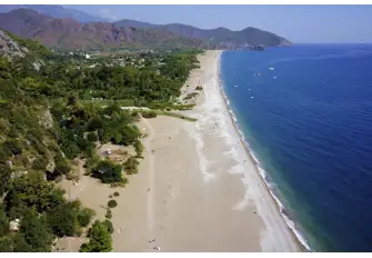 The pebbly Olympos Beach, home to the Eternal Flame, has a real Boho vibe