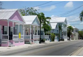 Discover the pastel coloured wooden townhouses