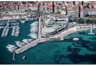 The Vieux Port is overlooked by historic Le Suquet on one side and the Palais des Festivals, home to the Cannes Film Festival, on the other