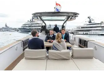 Johnny (right) gives his clients the lowdown on the Burgess charter fleet