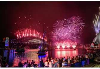 Observe the vibrant fireworks a shore or on board