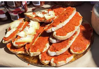 Picante sobrasada paired with Menorcan Mahón cheese on freshly made bread is a simple, rustic delight
