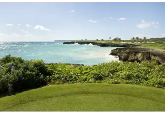 Admire the beautiful beachfront scenery between holes