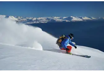 The skiing in Lyngen Fjord is exquisite - sand in summer there's 24-hour daylight
