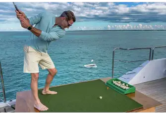 While you're waiting for the match to start, you can practice your swing while feeding the fish with biodegradable fish-food golf balls