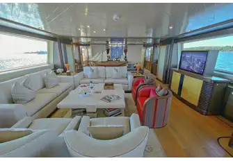 The view forward in the main saloon with formal dining behind the model ship