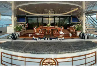 The open-air dining area on the main deck aft
