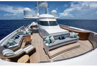 The forward sun deck has a wet bar to port, sun lounge to starboard and a forward-facing sofa