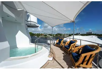 The jacuzzi is built into the mast, which also houses an elevator serving all guest decks. The deck space aft serves as a boat deck on passage