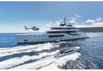 Two tenders stow behind shell doors on the main deck forward, below the touch-and-go helipad