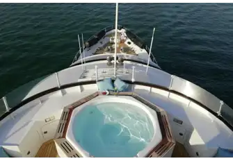 Her jacuzzi is screened from the breeze and overlooks the foredeck