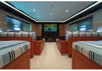 The lower deck cinema room has large loungers on which guests can enjoy movies