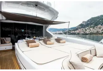 She has two large sunpads: one on the forward coachroof and another that covers the jacuzzi aft of the dining table shaded by an awning