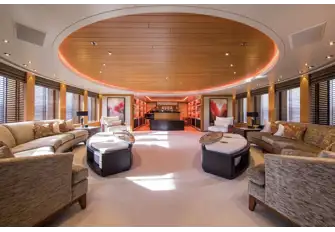 Looking forward in the main saloon. The lounge aft turns into a cinema room with projector and screen and there is a formal dining area past the piano lounge