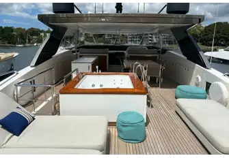 The aft sun deck with sun loungers and the teak-capped jacuzzi