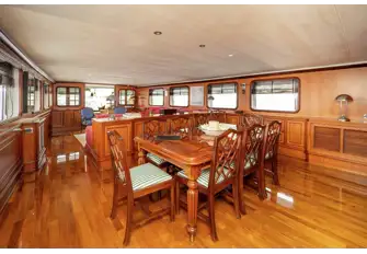 The formal dining area, aft of which is the main saloon