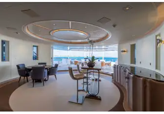 Looking aft past the bridge deck bar and lounge to the open-air dining area