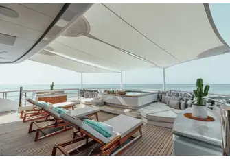 The sun deck aft has a pool surrounded by sunpads and sunlounging