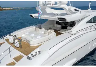Steps lead down to the swim platform and tender garage. Either side of the sunpad shell doors open to launch watertoys