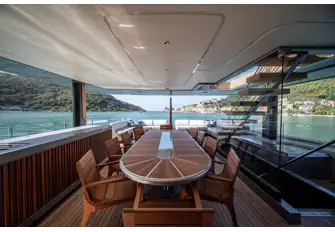 The bridge deck has a generously sized open-air dining table with a lounge aft where guests can take a digestif after dinner