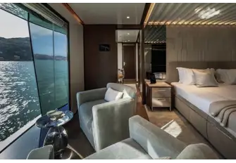 The full-beam master suite has a lounge next to a full-height window, a blissful place to start the day