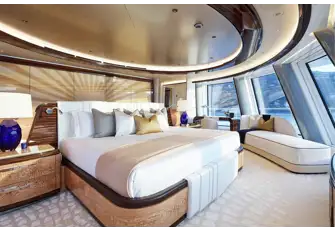 The master suite bedroom is forward on a private deck with spectacular views