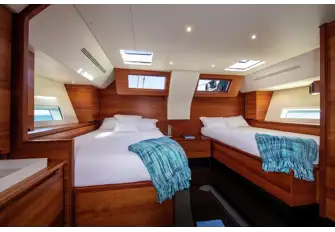 The master suite has plenty of natural light through hullports and decklights 