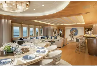 The dining table overlooks the main deck aft and the main saloon has huge picture windows