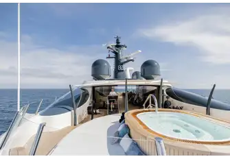 The forward sun deck has a raised jacuzzi encircled by sunpads and gym equipment inside and out