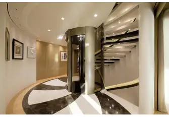 The glass-and-steel elevator serves all guest decks, lower to sun decks
