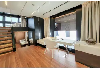 Enter the full-beam main deck owner's suite through the private study