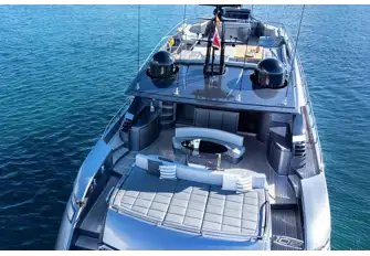 Open-air dining and a huge sunpad on the main deck aft