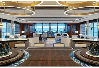 Looking aft from the dining table showing the vast windows that let in so much natural light