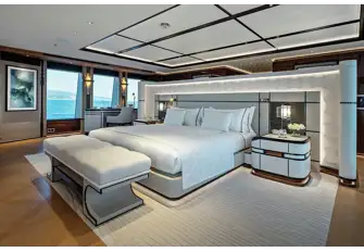 The owner's suite looks aft over a private terrace on the bridge deck
