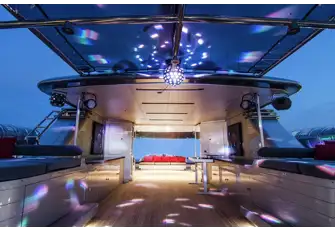 Looking aft from the jacuzzi with the sun deck in nightclub mode. There is also an outdoor cinema